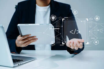Tech professional using tablet and digital interface with code. Concept of cybersecurity, innovation, software development