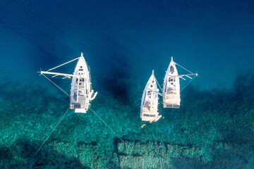 Sailing Boats Anchored in Blue Sea