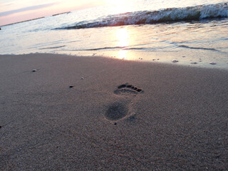 footprints in the sand Seascape sunset over the Baltic Sea Poland Europe