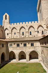 Obraz premium The inner courtyard of the Popes' Palace in Avignon, Provence, under a resplendent blue sky