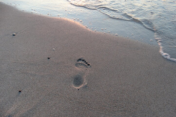 footprints on the beach Seascape sunset over the Baltic Sea Poland Europe