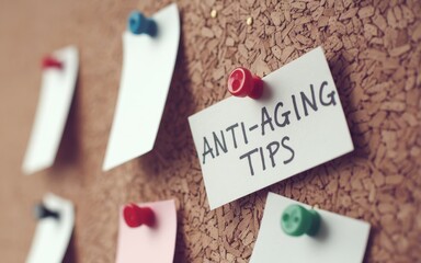 Prevention of aging signs concept. Notes on a corkboard highlighting anti-aging tips and advice.