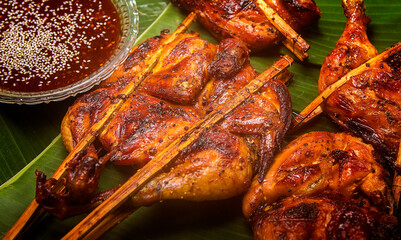 Delicious golden yellow charcoal grilled chicken.