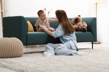 Mother spending time together with her son at home