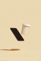 Floating smartphone and coffee cup on beige background – minimal lifestyle concept