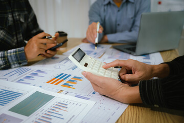 A professional business team collaborates around a conference table, analyzing charts, discussing strategies, reviewing reports, and planning innovative solutions to drive growth, efficiency, and long