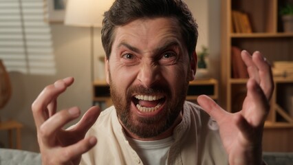 Crazy male man homeowner stressful on sofa problem crisis negative emotions angry annoyed scream...