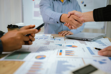 A professional business team collaborates around a conference table, analyzing charts, discussing strategies, reviewing reports, and planning innovative solutions to drive growth, efficiency, and long