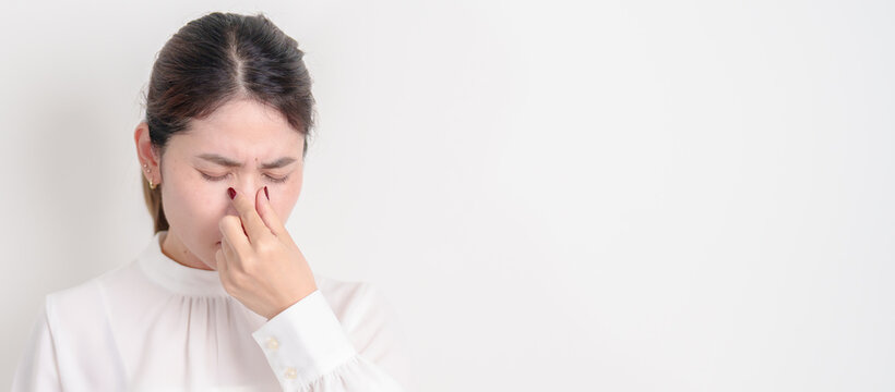 Business Woman having Nose pain for concepts of Nose disease, Common Cold, Influenza, Flu, Covid 19, Respiratory Infection, Sinusitis, Allergic Rhinitis, Asthma, Allergy, Dry nose Anosmia and Health