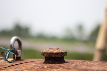An old machine's upper part and a background blur