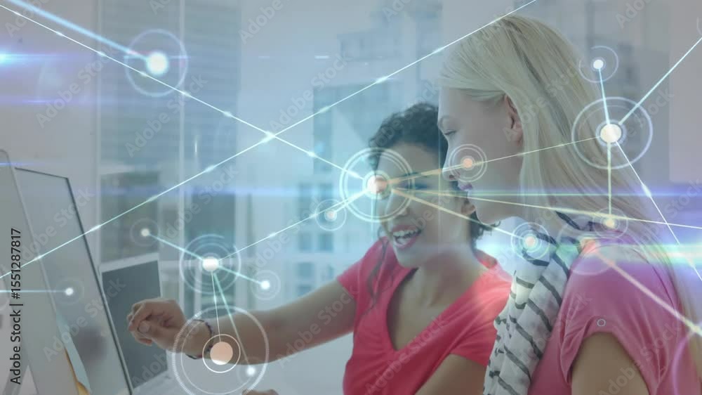 Aufkleber two women gesturing at monitor and initiating animated network overlay and analyzing business data