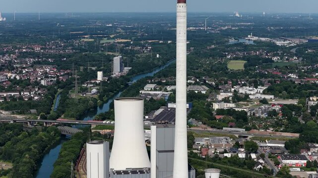 Smoke stacks adn cooling towers at power plant Herne, STEAG Heizkraftwerk Herne, Germany. coal fired thermal power station.