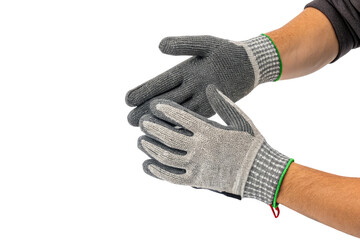 A pair of hands wearing gray and white work gloves against a black background in a studio shot