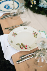 Wedding decor and vintage plates on the table