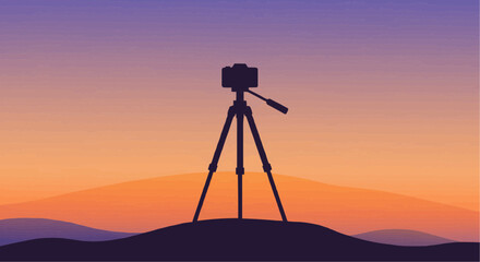 A camera on a tripod, capturing the sunset over rolling hills.