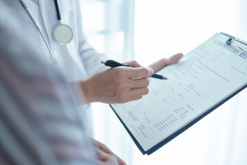 Female doctors who treat patients make an appointment to listen to the results after a physical...