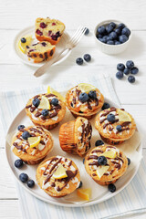 tasty blueberry muffins with lemon chocolate glaze
