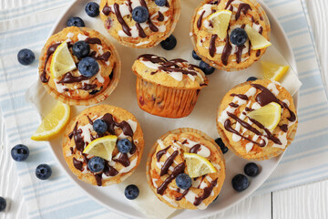 tasty blueberry muffins with lemon chocolate glaze