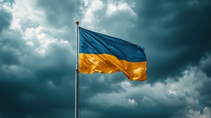 Ukrainian flag waving against dark, dramatic sky