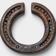 A heavily rusted horseshoe with visible nail holes and a distinct gap in its curve