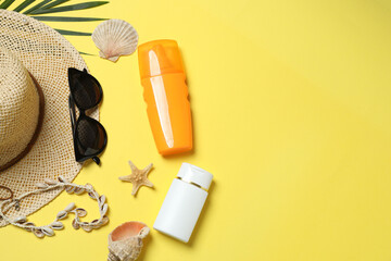 Tropical vibes shot from above. Straw hat, sunglasses, pineapple, wicker bag, beach accessories on...