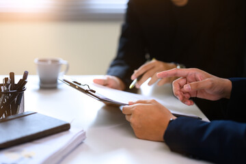 Cropped shot businessman reviewing contract before signing