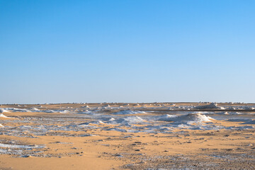 White rock formations and sand dunes in Egypt's White Desert, natural desert landscape