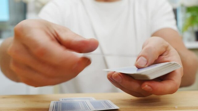 hands deal playing cards before the game. gambling. A board game for spending leisure time with friends and family.