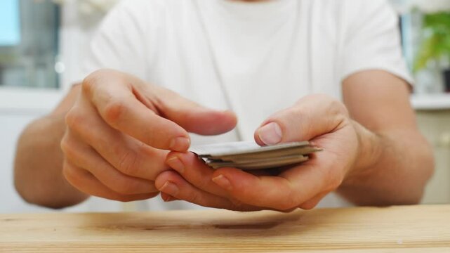 male hands shuffle a deck of playing cards. gambling. A board game for spending leisure time with friends and family.