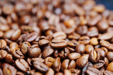 beans of roasted natural coffee. coffee background and texture. Aromatic invigorating drink.