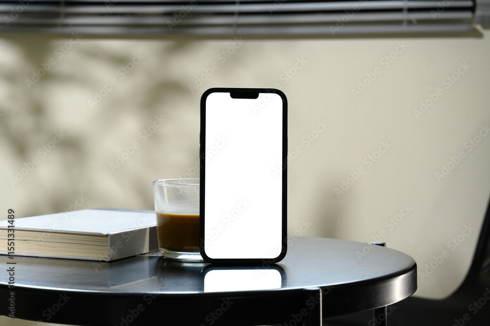 Aufkleber front view of smartphone with blank screen and coffee and book on on a sleek black table