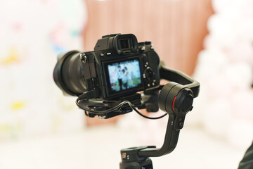 A professional black camera for taking photos and videos at the holiday. 