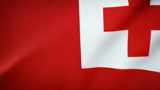 Waving national banner design, red field quartered with a bold white cross, patriotic symbol of Tonga