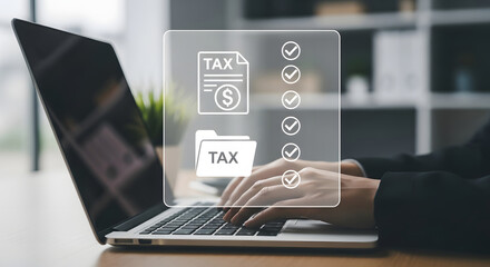 Close-up of hands typing on a laptop with a digital overlay showing a tax document, folder, and checklist, symbolizing online tax preparation and filing.