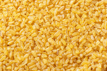 Cereal grains of bulgur. Macro shot. Cracked wheat