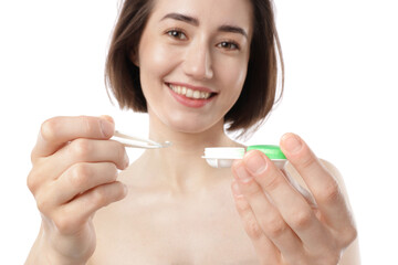 Woman with contact lens and case on white background, selective focus