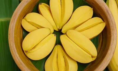 Fresh yellow pisang kepok bananas beautifully arranged in wooden bowl