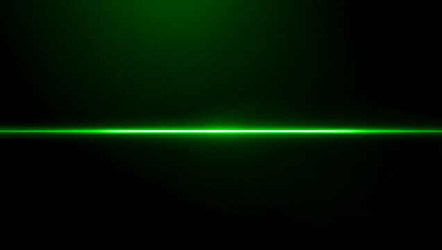 Bright green laser beam cutting through darkness with a starburst effect