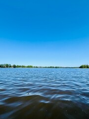 Blue sky and blue lake view, peaceful summer lake view