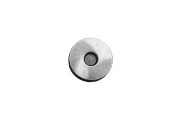 Round silver magnetic snap fastener for bags is isolated.