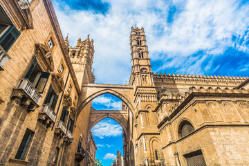 A closeup view of Palermo Cathedral, in Sicily, Italy, capturing its historic architecture, and vibrant blue sky, this iconic religious site is framed by the city's Mediterranean charm