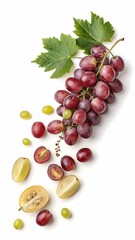 Obraz premium Fresh red and green grapes with leaves and sliced fruits on a white background
