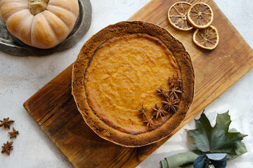 Pumpkin pie garnished with anise. Homemade traditional American thanksgiving pie, top view