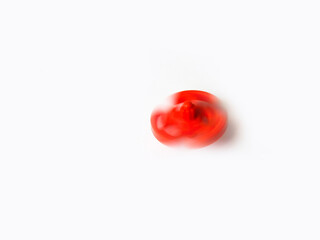Beautiful and cute red color plastic spin toy isolated on white background.