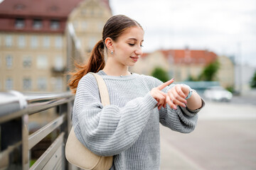Cute Girl Looking At Watch Waiting For A Meeting In The City
