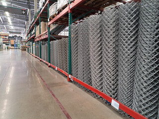 metal galvanized fence nets. roll of metal net in warehouse. Steel net cage for construction.rolls of wire mesh in the showroom