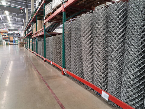 metal galvanized fence nets. roll of metal net in warehouse. Steel net cage for construction.rolls of wire mesh in the showroom