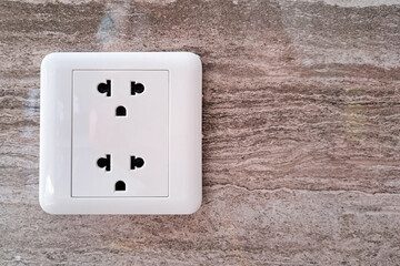 Electrical plug from household power outlet.white power socket on the wall.