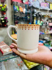 hand holding a cup of coffee