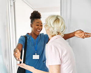 Doctor or nurse caregiver with senior woman at home or nursing home, a caregiver standing on the...